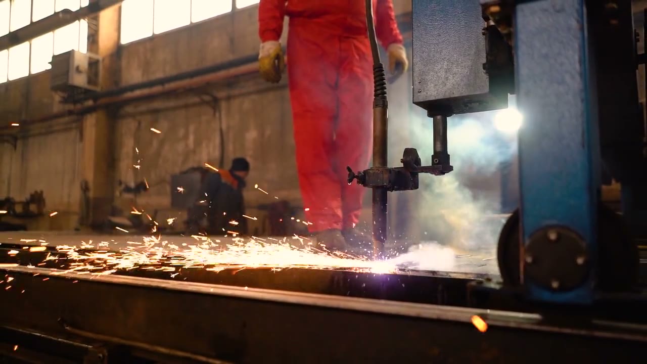 Sparks from metal cutting on a workshop floor